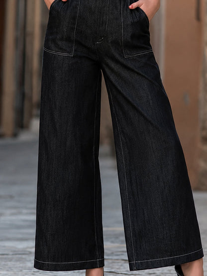 Tuta Zafren in denim nero con scollo profondo a V e collo all’americana