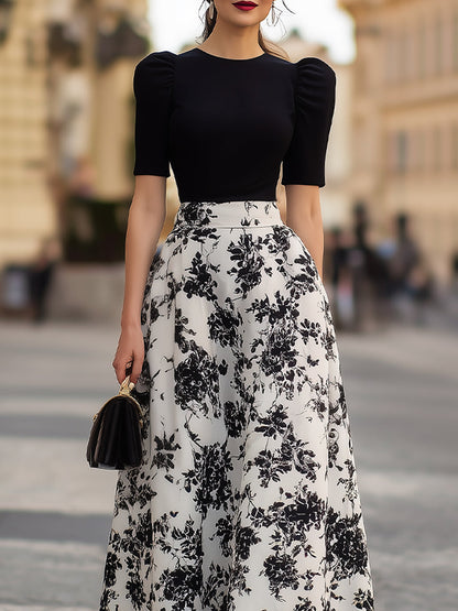 Robe noire à manches bouffantes et motif floral Zafren