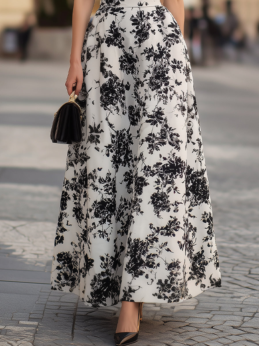 Robe noire à manches bouffantes et motif floral Zafren