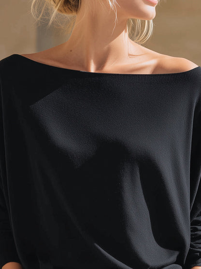 Top Zafren nero in maglia, scollo bardot e maniche a pipistrello