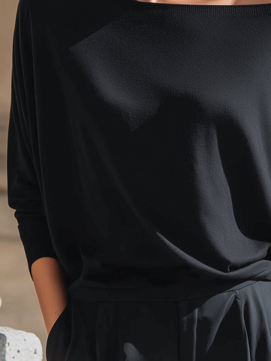 Top Zafren nero in maglia, scollo bardot e maniche a pipistrello