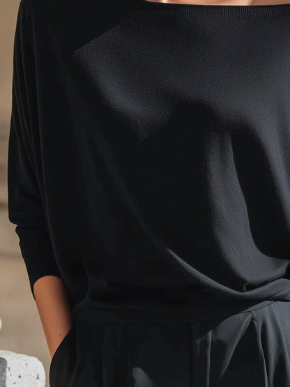 Top Zafren nero in maglia, scollo bardot e maniche a pipistrello