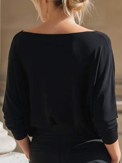 Top Zafren nero in maglia, scollo bardot e maniche a pipistrello