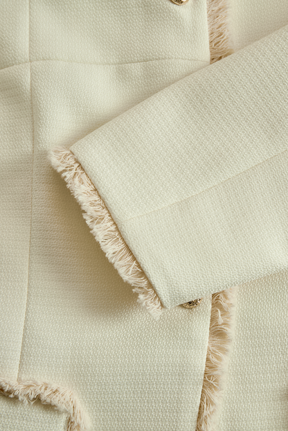 Blazer Zafren color crema con finiture sfrangiate e texture