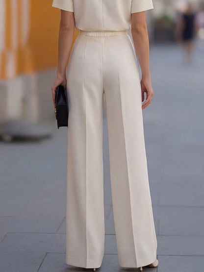 Pantaloni a gamba larga plissettati color avorio Zafren